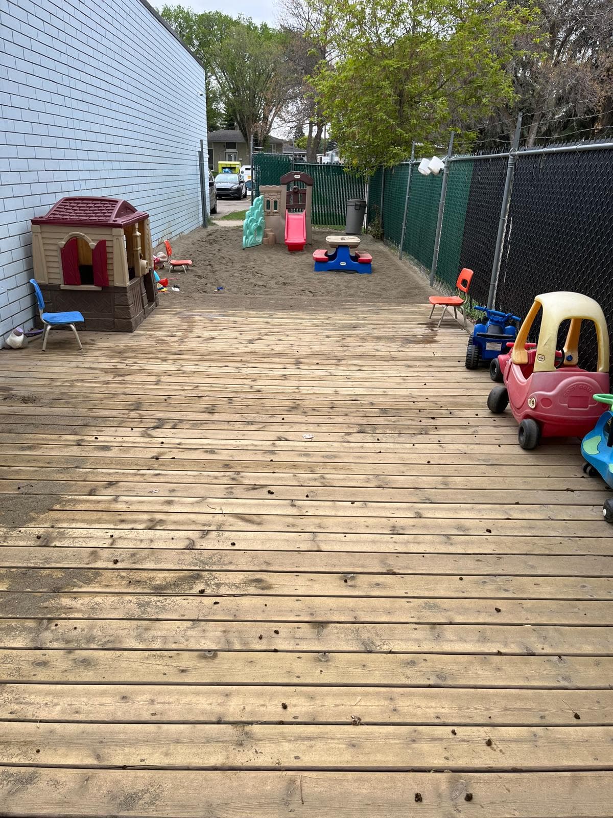 Play area with yellow shelves and toys